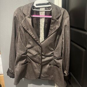 Maurice’s brown blazer